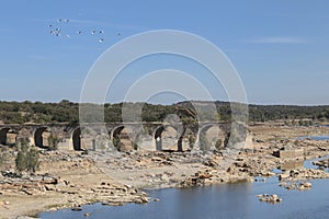 Remains of the Ajuda bridge over The Guadiana River photo