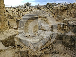 The remains of ancient columns in the chamber of the necropolis. Paphos, Cyprus. photo