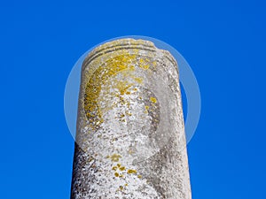 Remains of a ancient Greek column - clear blue sky background