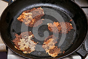 Remains of burnt food in the pan. concept carcinogen photo