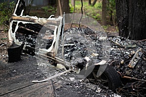 The remains of a burnt out mobile home trailer.