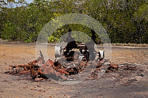 The Remains Of A Burnt Out Rusting Car Wreck