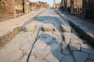 Remains of the cobblestone of a street in the city of Pompeii in the Roman Empire