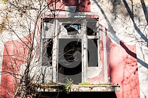 Remains of demolished and abandoned villa in the war zone damaged and destructed windows