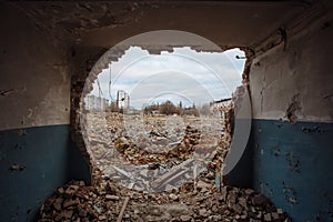 Remains of demolished old industrial building. Pile of stones, bricks and debris