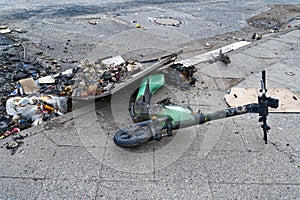 Remains of an e-scooter and rubbish following vandalism and arson