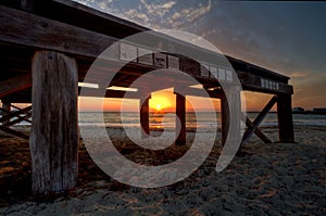 Remains of Fremantle pier at sunset