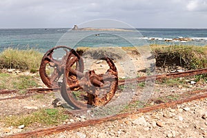 Remains after of granite mining on Ile Grande in Pleumeur-Bodou in Brittany - rails and rusty wheels
