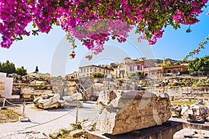 Remains of the Library of Hadrian, Plaka district and Acropolis in Athens old town, Greece. Famous landmark and popular travel des