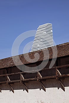 Remains of medieval Baselâ€™s city ramparts and modern skyscraper. Basel Switzerland.