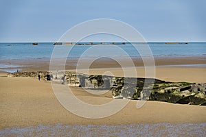 The remains of the Mulberry Harbour at Arromanches photo