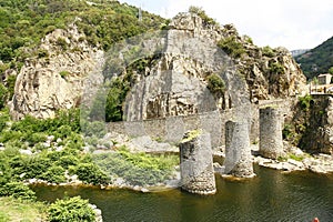 The ruins of a bridge over the river Borne photo