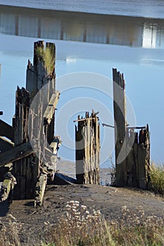 The remains of an old pier or dock on the banks of the river usk, newport, gwent, Wales, UK