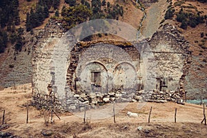 Remains of old ruined church, Dartlo village. Adventure holiday in Tusheti. Travel to Georgia. Mount landscape. Green ecology tour