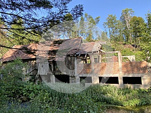 Remains of an old sawmill on the small dam of ÄŒogrljevo Lake in the mountain hamlet of TiÄ‡i - Gorski kotar, Croatia