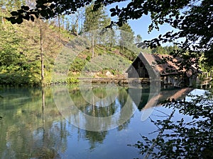 Remains of an old sawmill on the small dam of ÄŒogrljevo Lake in the mountain hamlet of TiÄ‡i - Gorski kotar, Croatia