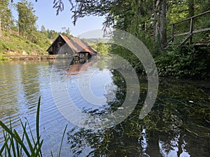 Remains of an old sawmill on the small dam of ÄŒogrljevo Lake in the mountain hamlet of TiÄ‡i - Gorski kotar, Croatia