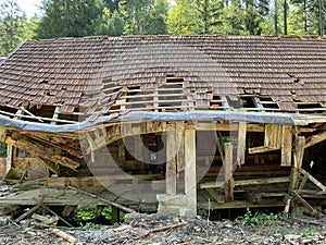 Remains of an old sawmill on the small dam of ÄŒogrljevo Lake in the mountain hamlet of TiÄ‡i - Gorski kotar, Croatia