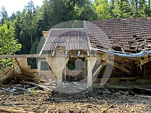 Remains of an old sawmill on the small dam of ÄŒogrljevo Lake in the mountain hamlet of TiÄ‡i - Gorski kotar, Croatia