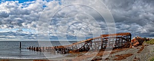 Remains of the old ship at San Gregorio in Magellanes, southern Chile photo