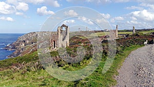 The remains of old tin and copper mines on the cliffs of Cornwall UK
