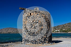 Remains of old traditional Greek windmills near Elounda, Crete