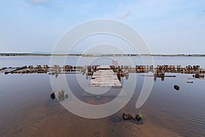 Remains of an old wooden pier on the banks of the Barguzin River near the Barguzinsky Bay of Lake Baikal,