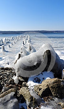 Remains of a pier frozen on Cayuga Lake