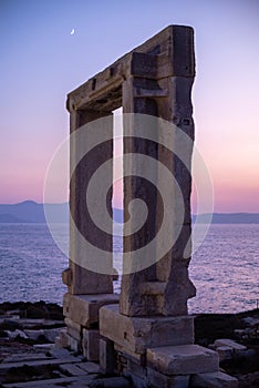 Remains of Portara gate of the Temple of Apollo at Naxos island in the Cyclades, Aegean Sea, Greece