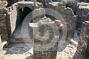 Remains of the Roman amphitheatre in the historic centre of Catania, Sicily island, Italy photo