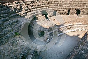 Remains of the Roman amphitheatre in the historic centre of Catania, Sicily island, Italy photo