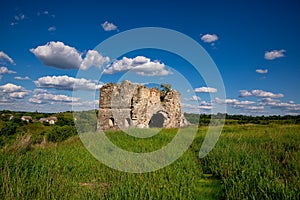 Remains and ruins of an old castle in Europe. UNESCO heritage in the Ukrainian village Sutkivtsi