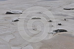 Remains of salt on fifth stage of sea salt production field