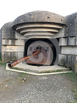 Remains of a Second World War WW2 military battery with artillery and guns at Longues-sur-Mer, Normandy, France