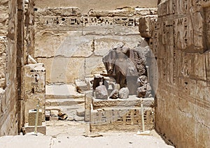Remains of a statue at the entrance to a side chapel in the Hippostyle Hall of the Temple of Ramesses III in Medina Habu.