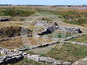 Remains of the stone foundation of an ancient building were unearthed in the field
