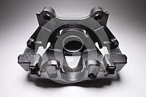 Remanufactured disc brake caliper painted dark gray. Brake system restoration