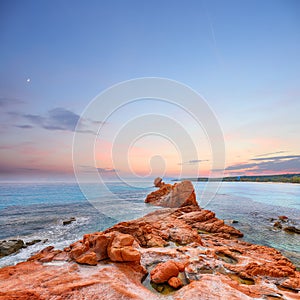 Remarkable sunset view of Red Rocks (is Scoglius Arrubius) on Cea beach photo