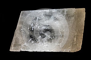 A remarkably clear and translucent mineral specimen, displaying a blocky, somewhat rectangular or rhombohedral cleavag