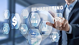 Remarketing digital marketing concept. Businessman presses remarketing on virtual screen.