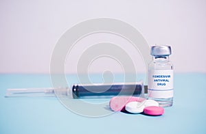 Remdesivir antiviral drug with pills and Syringe as background - concept of covd-19 or coronavirus new possible photo