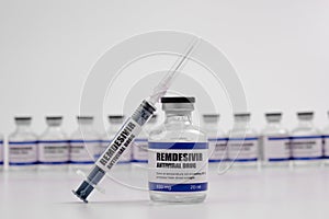 Remdesivir antiviral injectable drug vaccine medicine vial Covid-19 Corona Virus 2019-ncov syringe injection. Vaccination,
