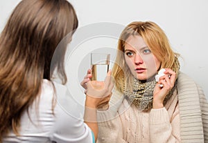 Remedies should help beat cold fast. Tips how to get rid of cold. Woman consult with doctor. Girl in scarf hold tissue