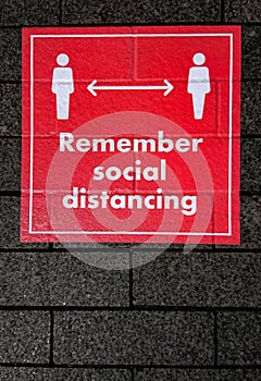 Remember Social Distancing Red Road Sign