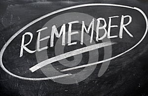 Remember word written on a blackboard photo