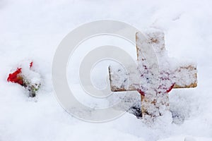 Remembrance Cross With Poppy In The Snow