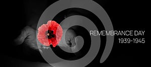 Remembrance Day Banner Template. Red Poppy over Burning Candle in the Human Hands.