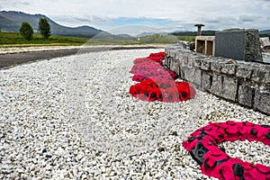 Remembrance day poppies laying close to the commando memorial in Spean bridge, Scotland - United Kingdom
