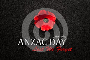 The remembrance poppy - poppy appeal. Poppy flower on black textured background. Decorative flower for Anzac Day.