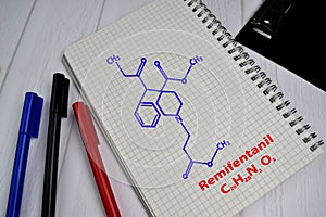 Remifentanil molecule write on the book. Structural chemical formula. Education concept